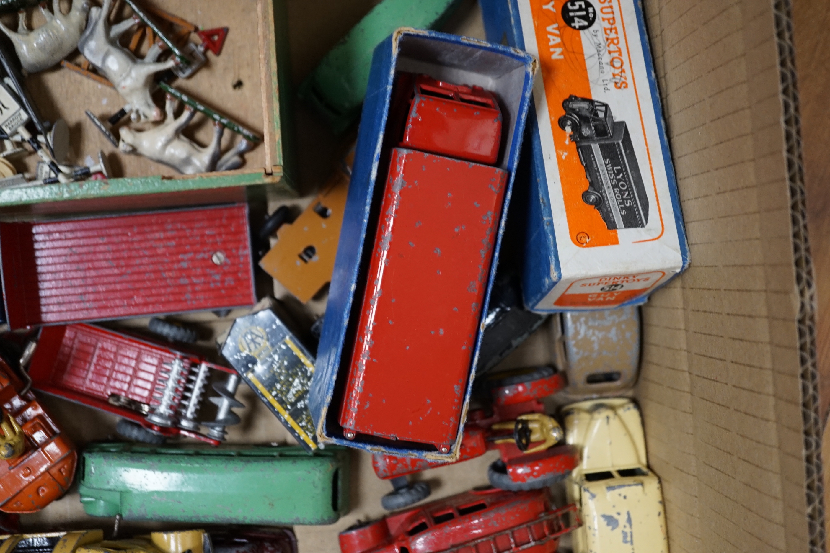 Twenty Dinky Toys and Supertoys including two Guy vans (514); Lyons and Slumberland, two taxis, a Vanguard, Daimler ambulance, Bedford refuse lorry, Guy Flatbed, M.G. Record car, etc. together with a quantity of assorted